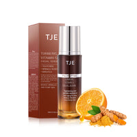Applying Vitamin C Turmeric Face Serum to face